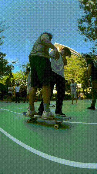 teaching-skateboarding.gif
